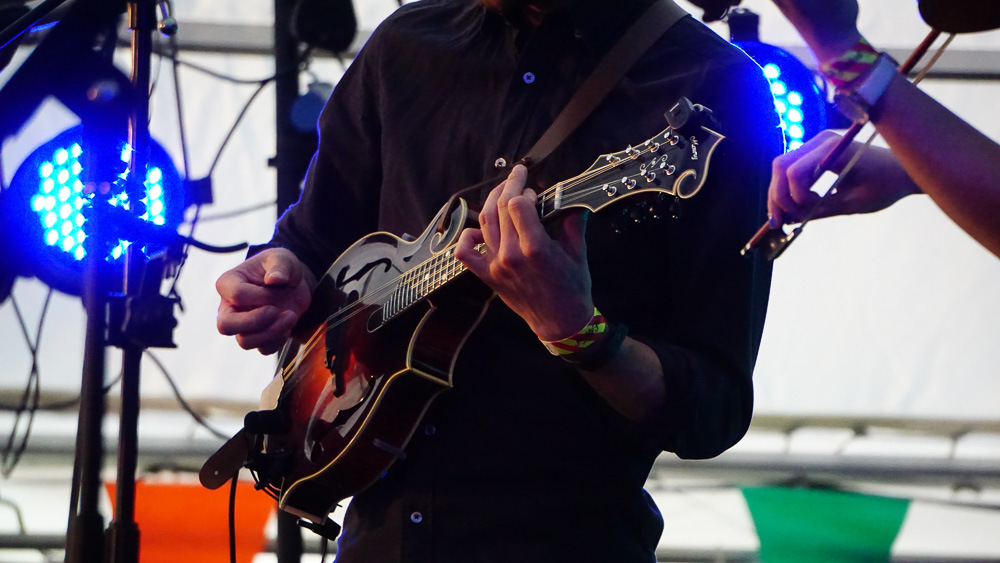 A person playing a guitar.