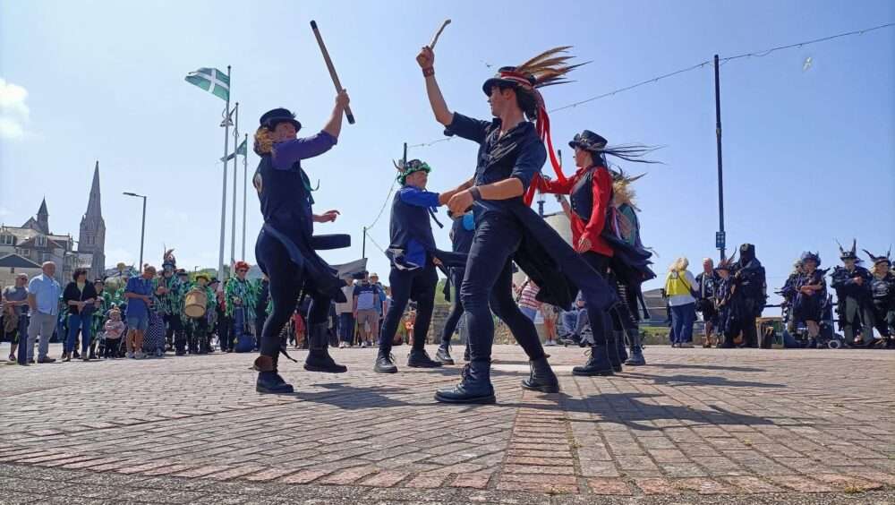 Dancers with sticks.